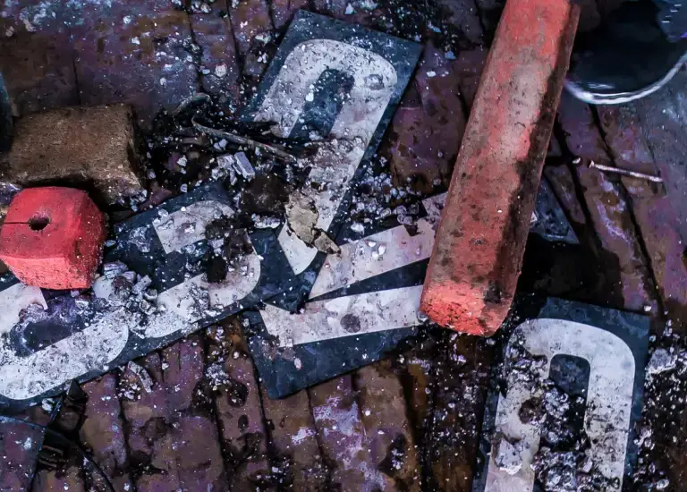 a close up of a street sign on a wooden surface
