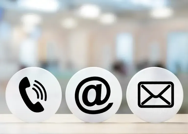 three balls with email and telephone symbols on them