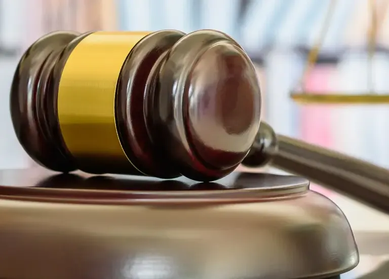 a judge's gaven sitting on top of a laptop computer