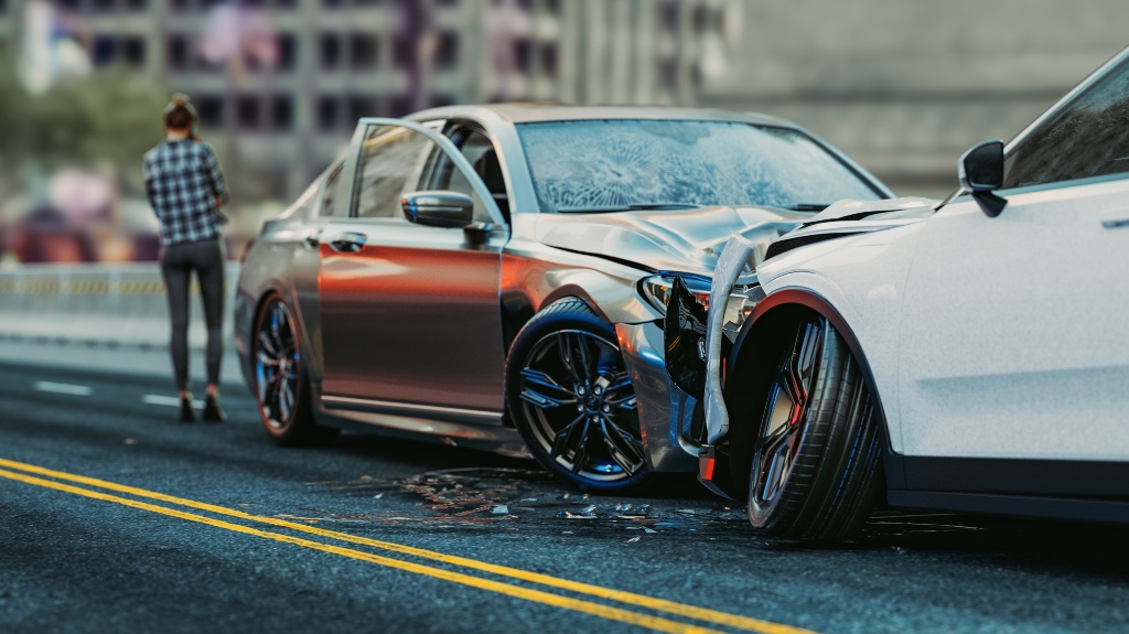 woman talking on phone after two cars collided