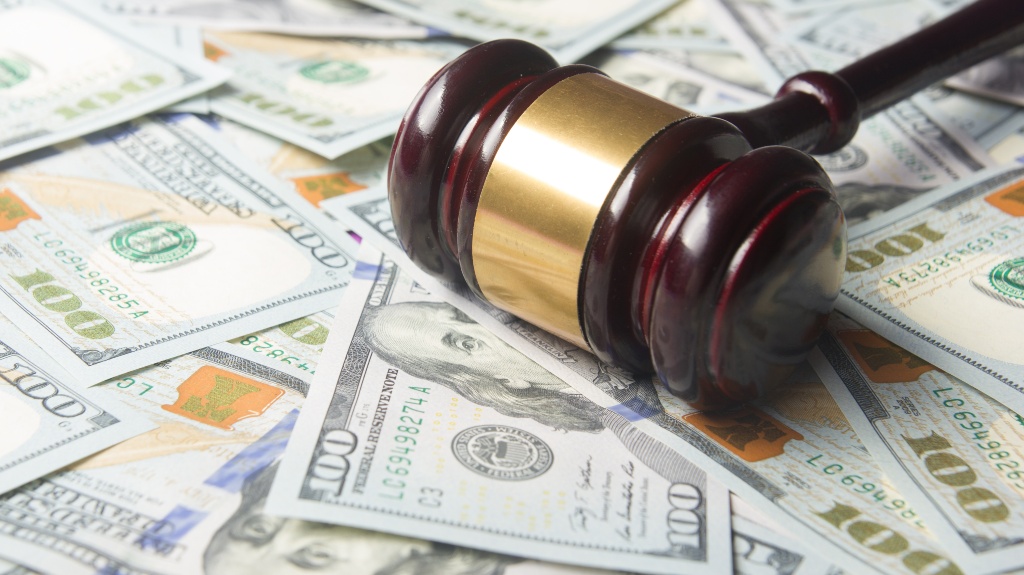 Judges Gavel on the dollar cash background