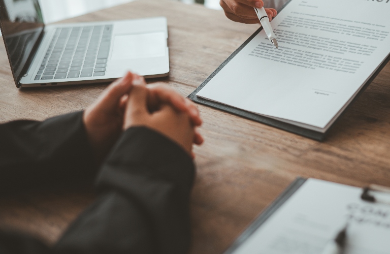 Client is reviewing documents with lawyer